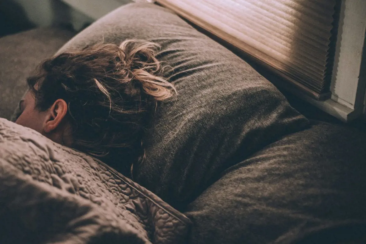 Person sleeping in bed illustrating how good sleep supports sperm health and improves sperm survival rates